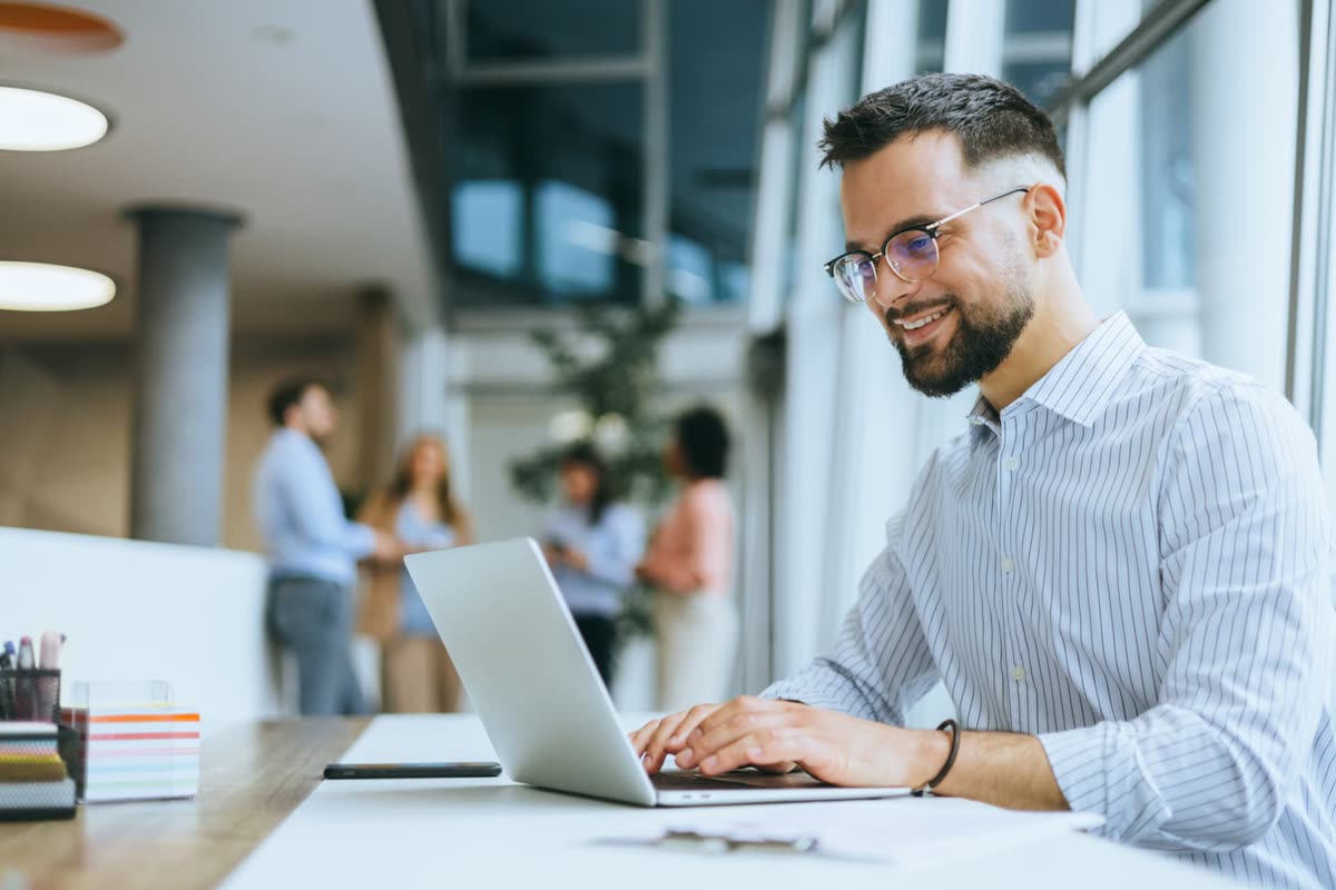 An MSP team member registering a deal on a laptop.